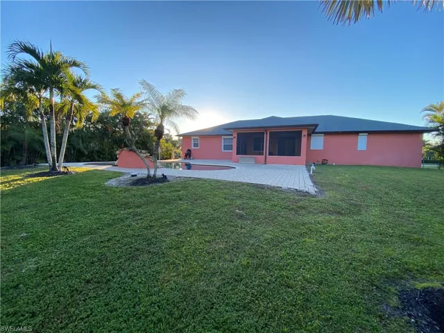 View of yard featuring a patio and a sunroom