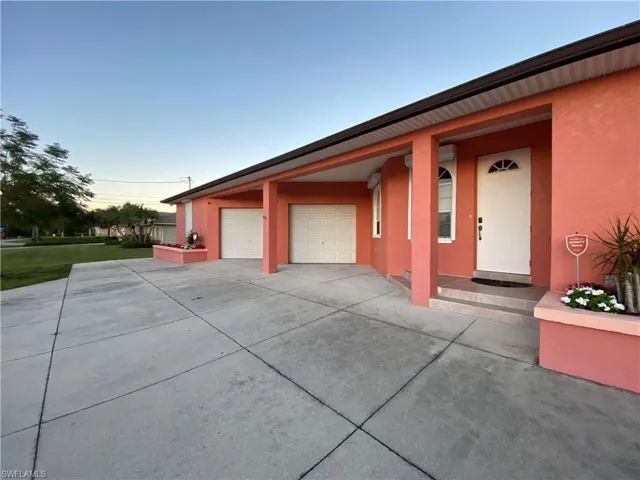 View of garage at dusk