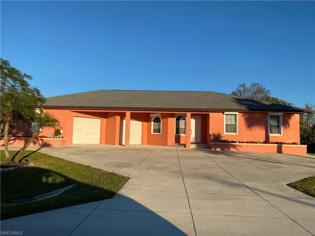 Ranch-style home featuring a garage