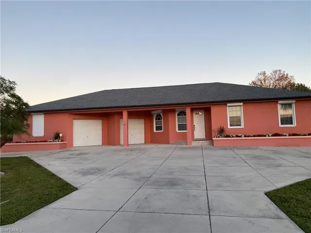 Ranch-style home featuring a garage