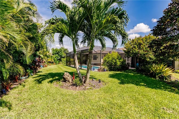 View of yard with a lanai