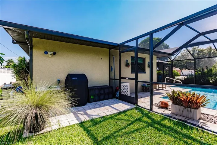 View of patio / terrace with glass enclosure and a fenced in pool