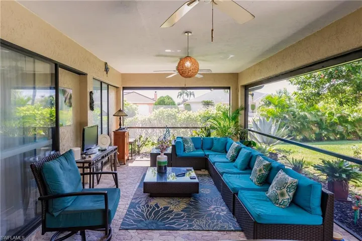 Sunroom featuring ceiling fan