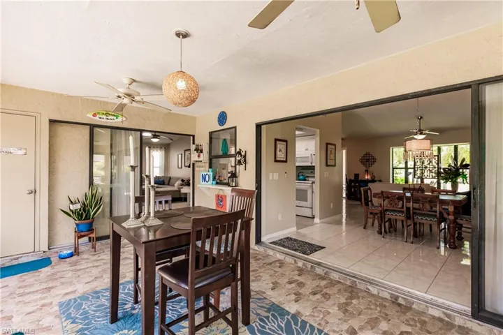 Dining area with ceiling fan and light tile patterned floors