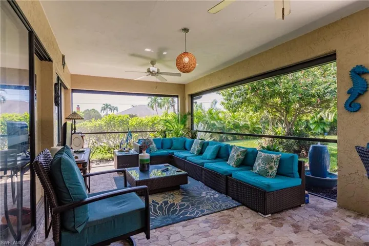 Sunroom featuring ceiling fan