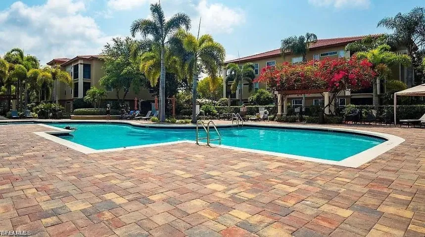Community pool with a patio area