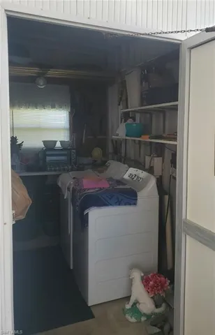 Washer and dryer are conveniently located in the breezeway shed
