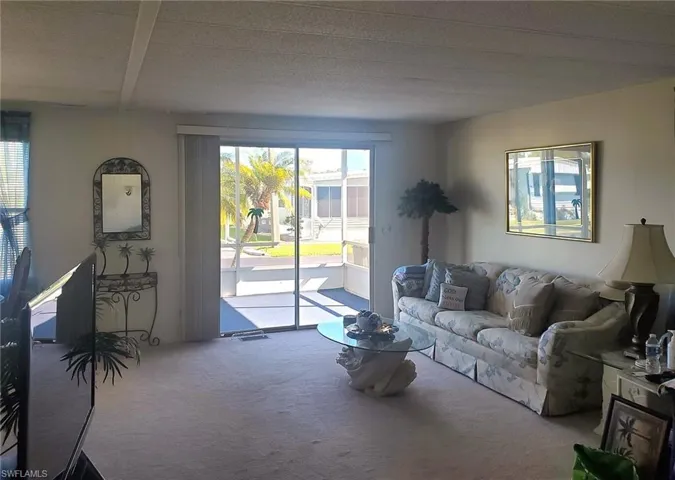 Living room with view to Florida room.