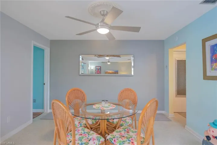 Dining room with carpet and ceiling fan