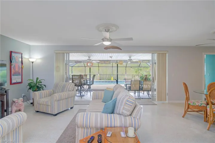Living area with healthy amount of natural light and a sunroom