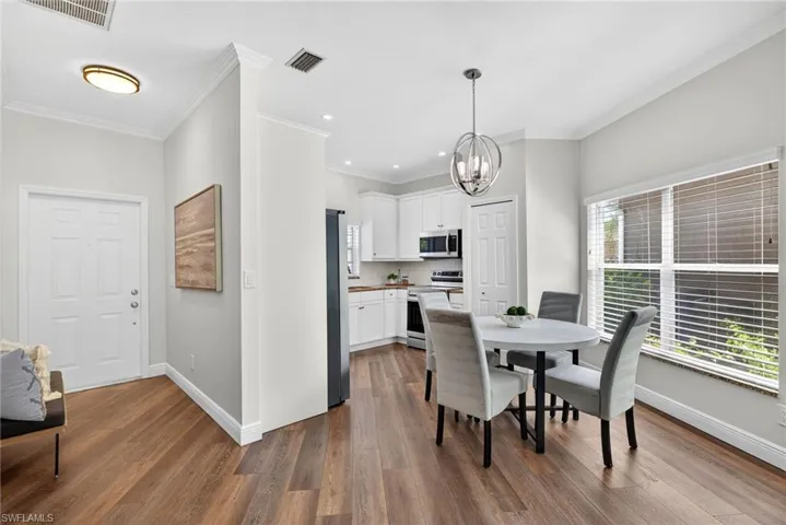All new flooring throughout, updated paint, roof replaced in 2022, hot water heater, electric panel, and HVAC all updated, with no flooding ever.