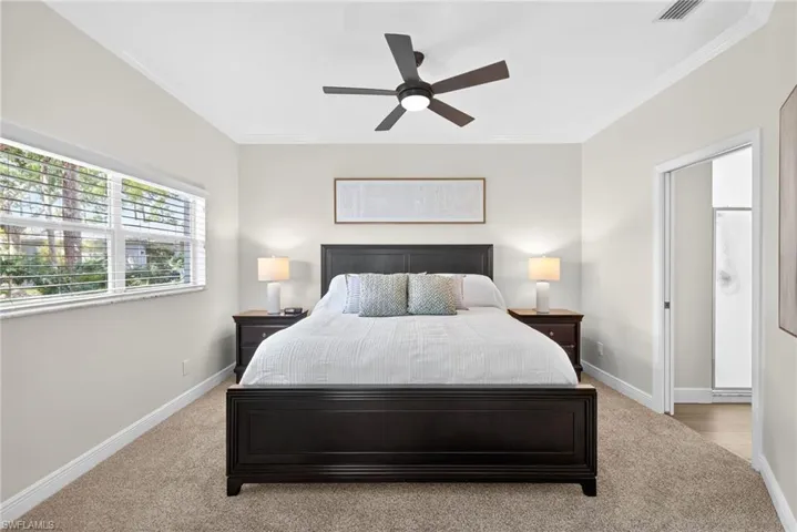 sleep tight in the elegant primary bedroom