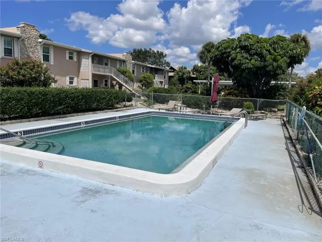 Community pool with a patio area