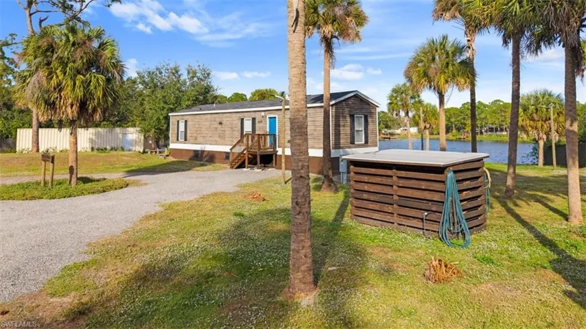 View of front of property with a water view