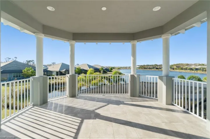View of patio featuring a balcony and a water view