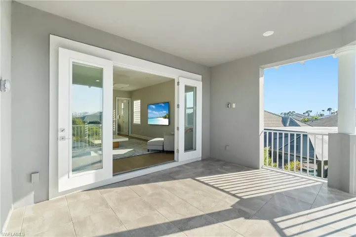 Doorway featuring light tile patterned floors