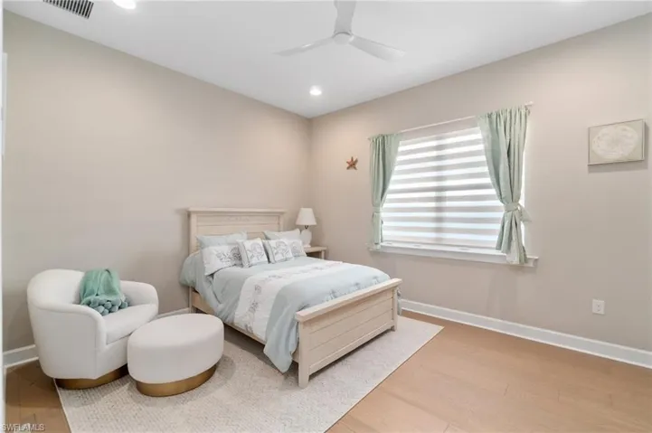 Bedroom with wood-type flooring and ceiling fan