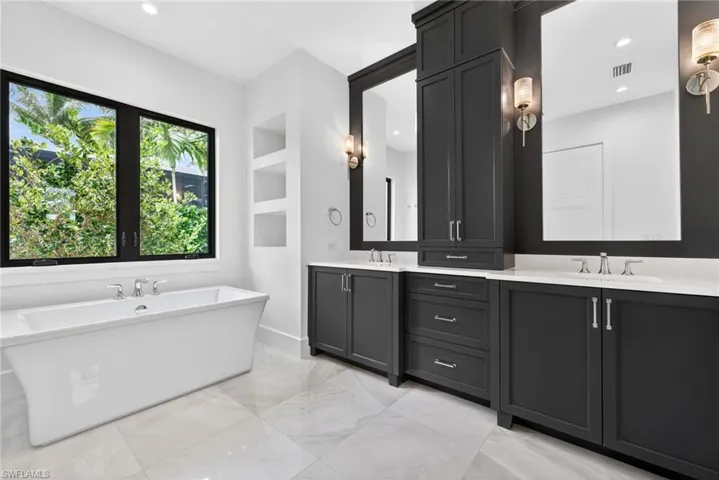 Master bathroom , stunning double vanity, tile floors and large soaking tub