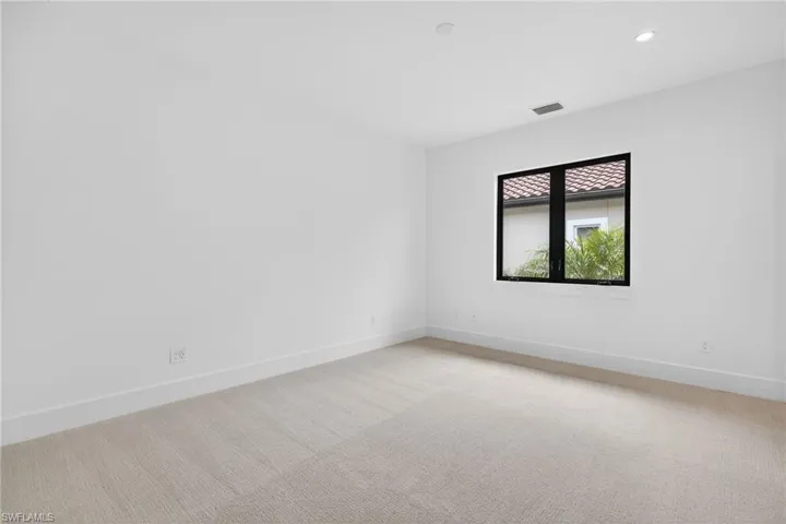 Bedroom 2  featuring light colored carpet and recessed lighting