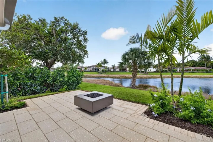 terrace  with a gas fire pit and a stunning water view