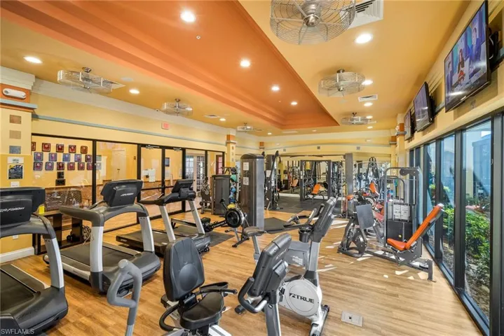 Workout area with recessed lighting and ornamental molding