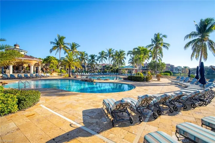 Community pool with a patio area and a gazebo