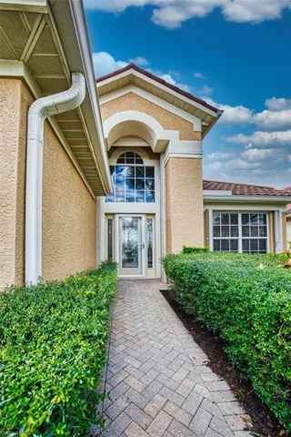 Property entrance featuring stucco siding