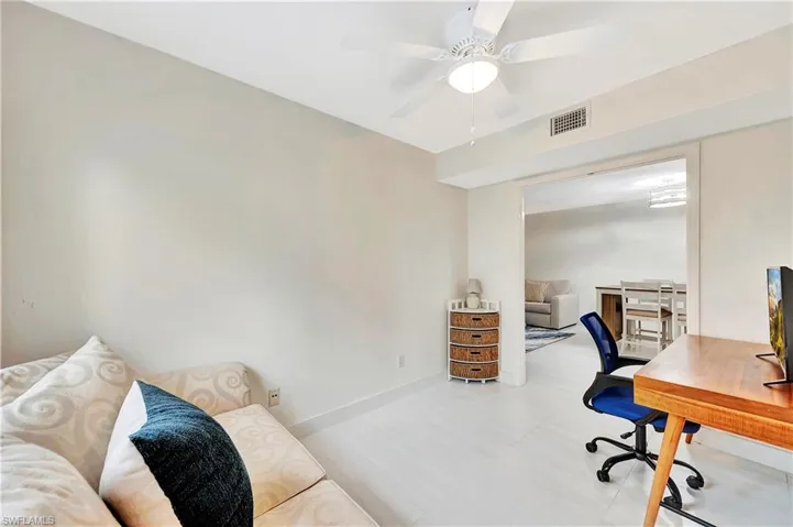 Den open to living/ dining area