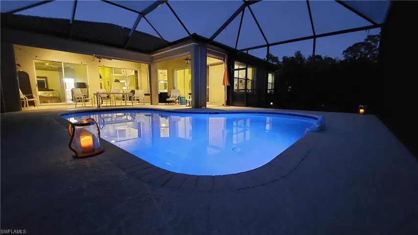 resurfaced pool dusk view with LED lighting