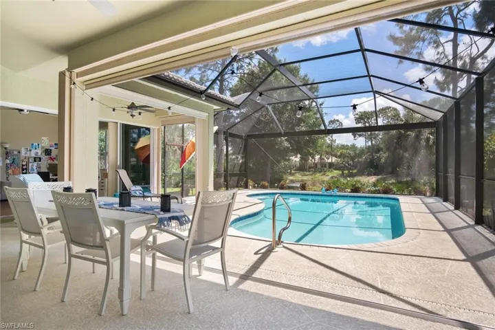 resurfaced pool with picture view lanai and cover pool deck space