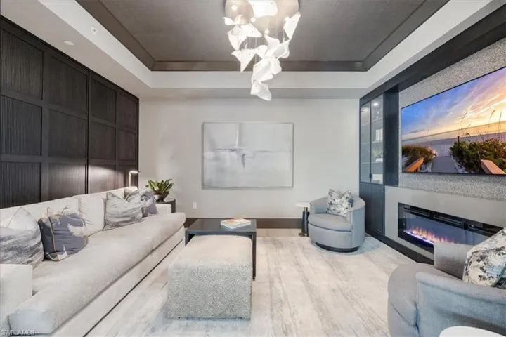 Lounge area with custom built-ins and paneled walls