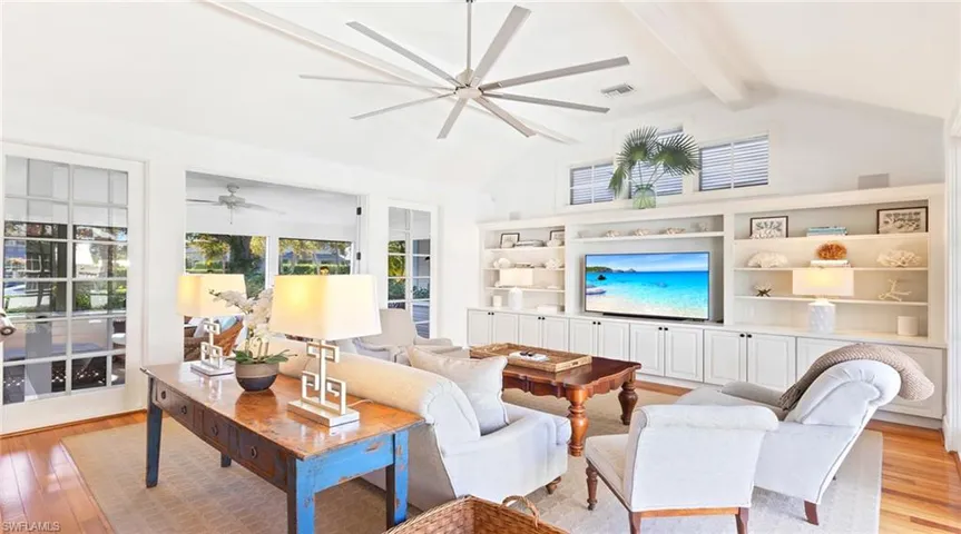 Living area with light wood-style flooring and ceiling fan