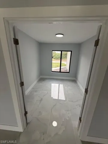 Empty room with baseboards