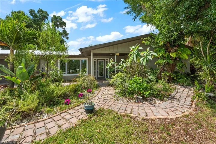 Brick Entry with Dessert Roses and other Lush Landscaping