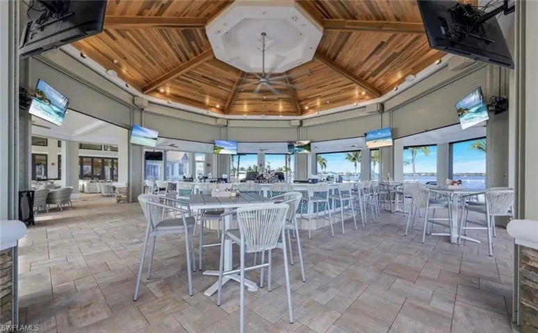 View of patio with a gazebo and outdoor dining space
