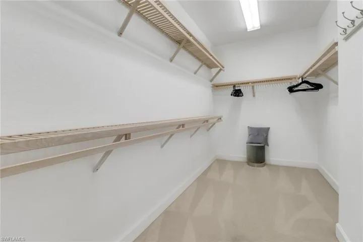 Walk in closet featuring carpet