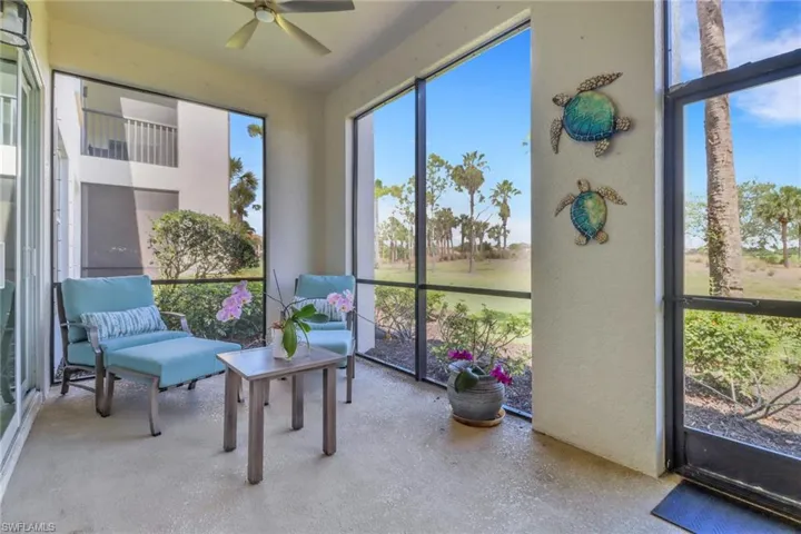 Sunroom / solarium featuring ceiling fan