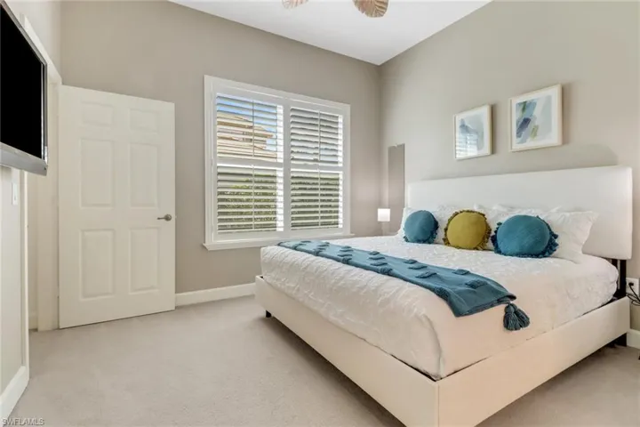 Carpeted bedroom with baseboards