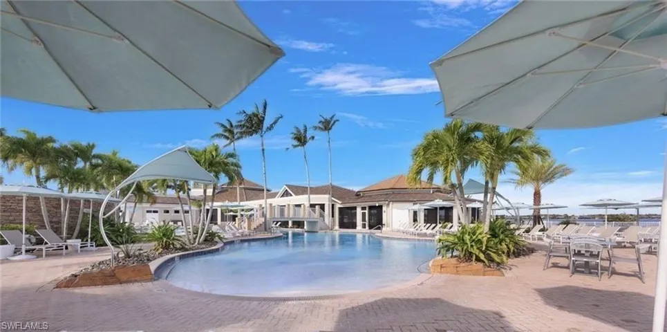 Community pool with a patio