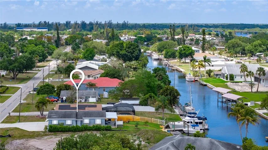 Bird's eye view with a water view and a residential view