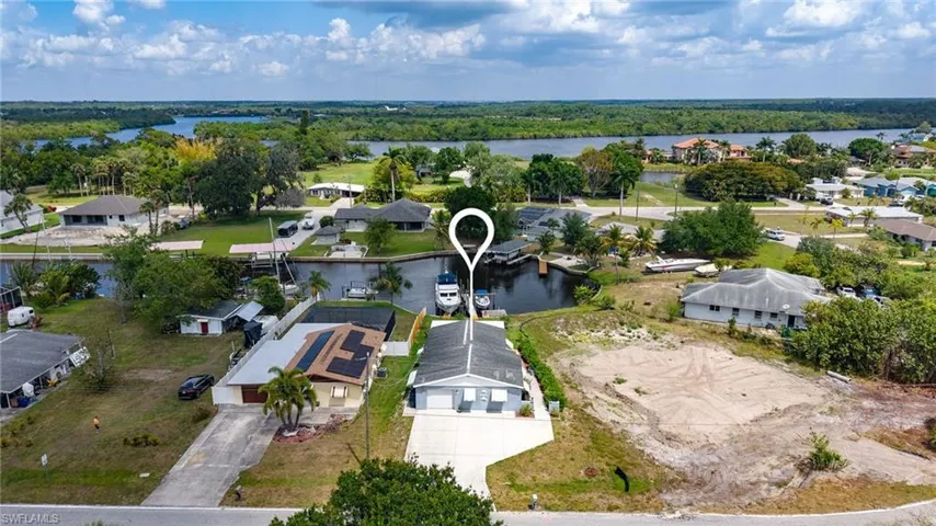 Aerial view featuring a water view and a residential view