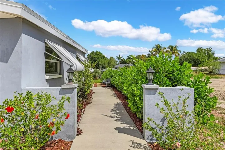 View of side of home with stucco siding
