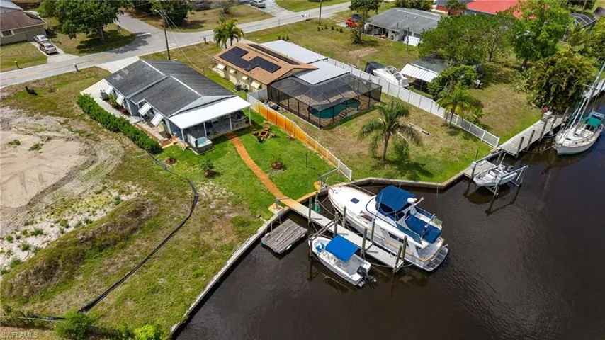 Aerial view featuring a water view and a residential view
