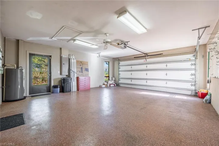 Garage featuring epoxy flooring and ceiling fan
