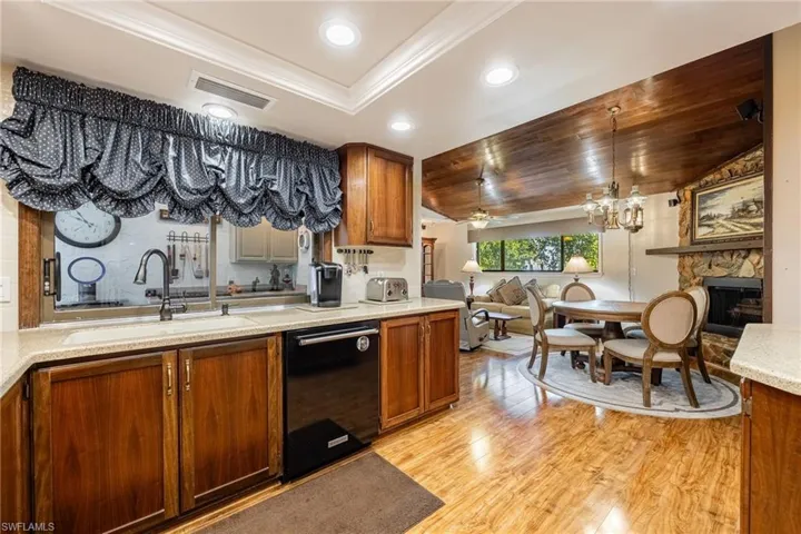 Kitchen featuring tray ceiling and recessed lighting