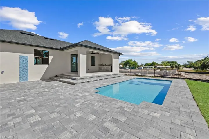 View of pool featuring a fenced in pool, a patio, a ceiling fan, and fence