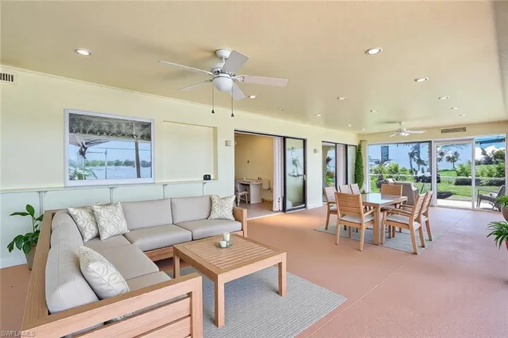 Living room featuring visible vents, recessed lighting, concrete floors, and ceiling fan