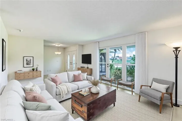 Living area with light wood-type flooring and baseboards