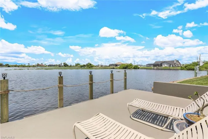 View of concrete dock with a water view. Hose spigot and electric at the dock.