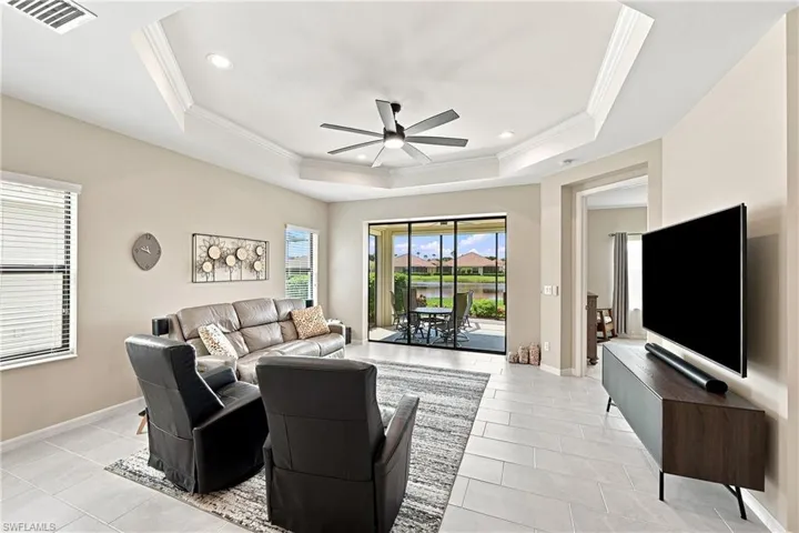 Tray ceiling with recessed lighting and a ceiling fan